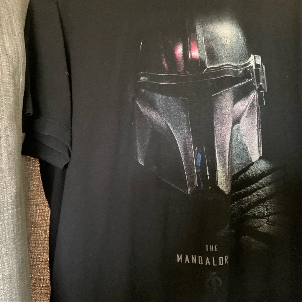 Large Mandolorian t-shirt, been in storage. Will wash before shipment